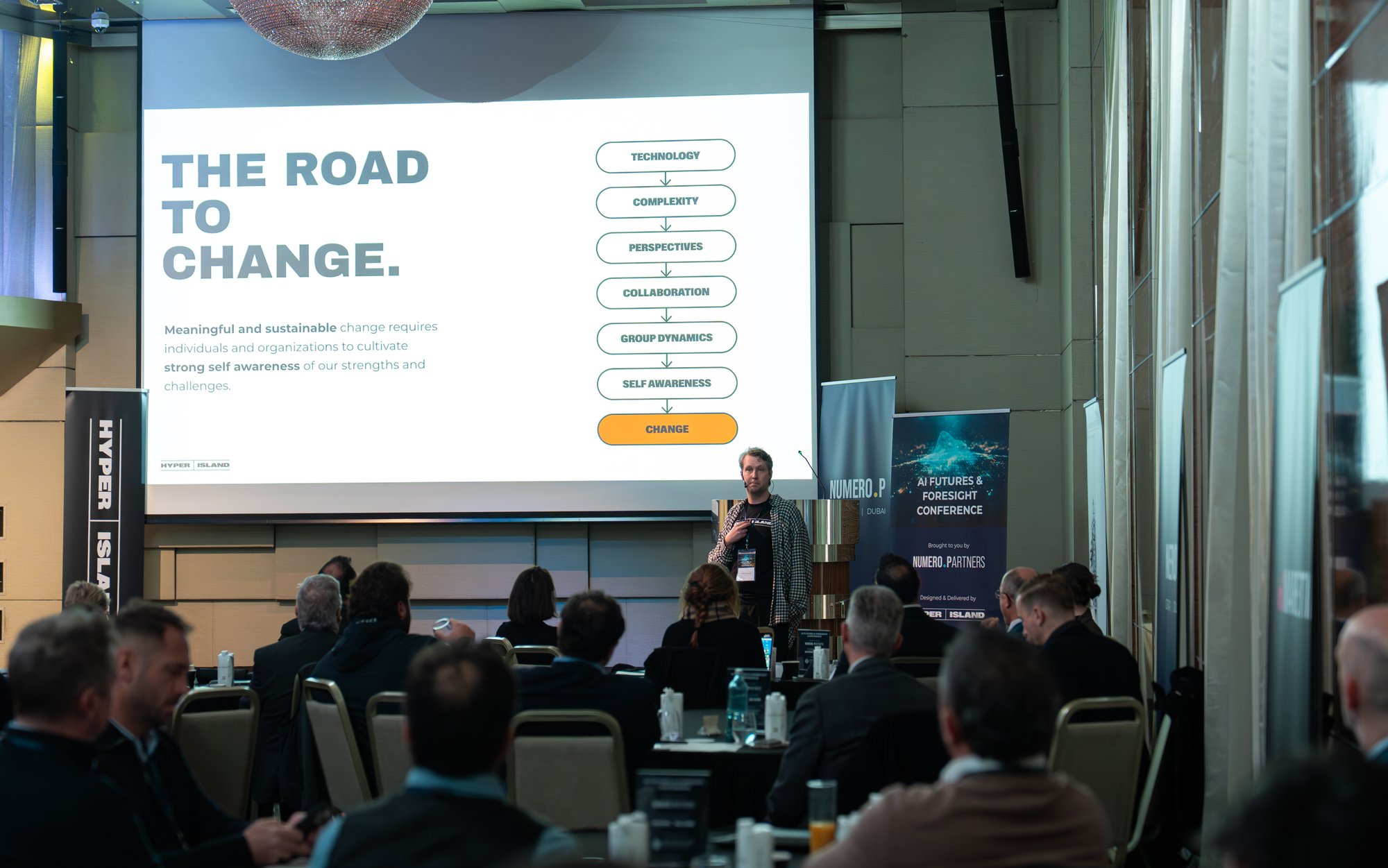 Speaker presenting on change and technology at the Gibraltar AI conference.