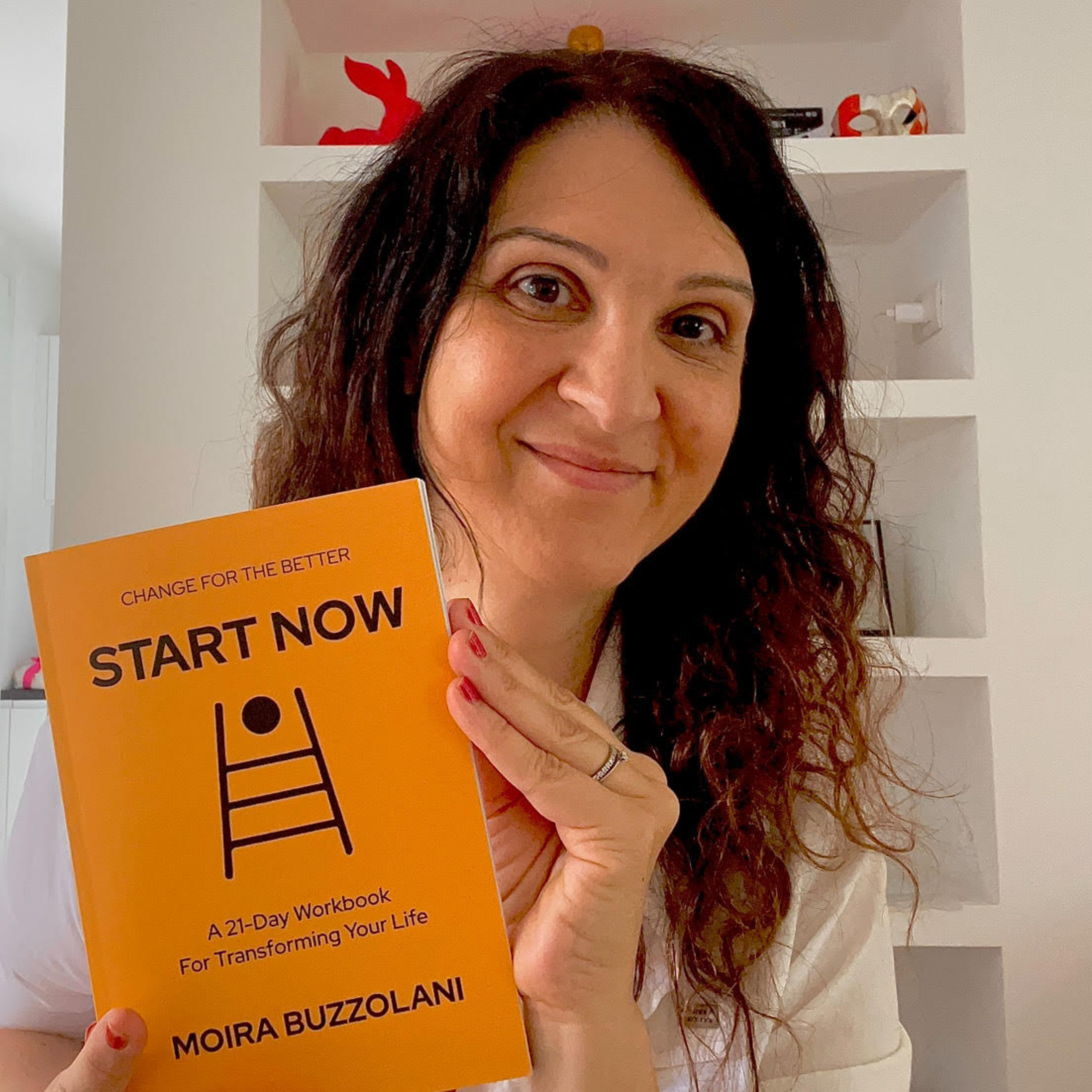 Moira Buzzolani, subject of the blog post, holding up her book 